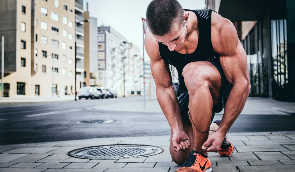 guy-kneeling-with-headphones