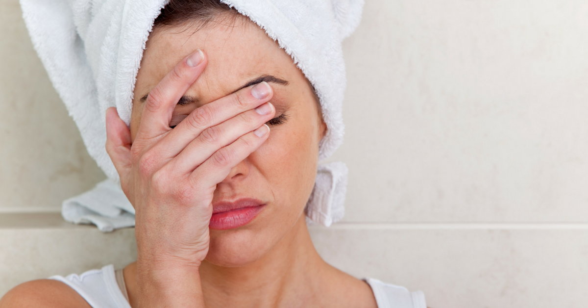 ibs-food-intolerance-women-hand-on-face