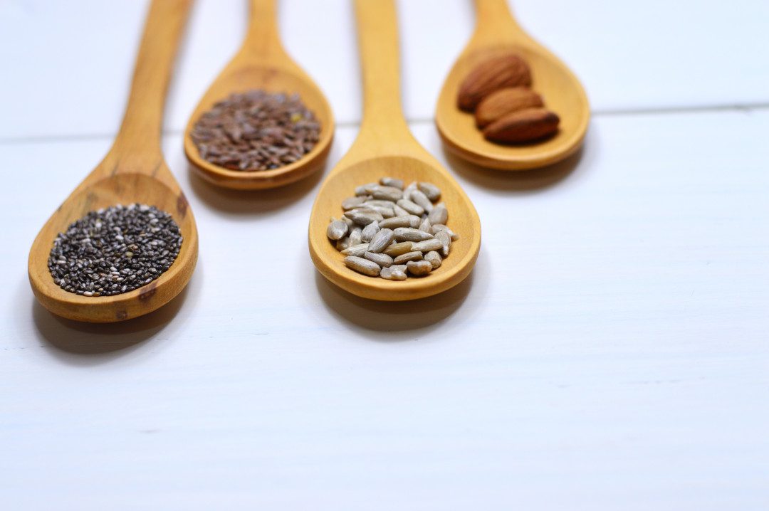 four brown wooden spoons